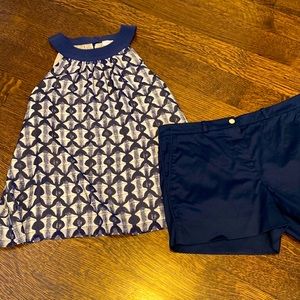 Navy Tory Burch shorts.